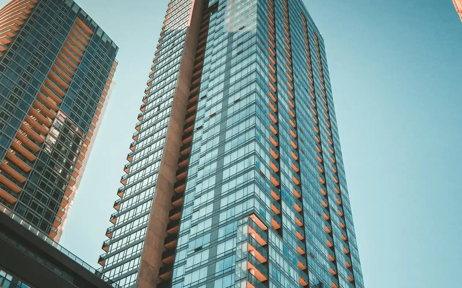 A glass tower against a clear sky